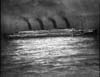Изображение Титаника ночью, стоящего на якоре в Шербуре. Этот снимок Фрэнк Браун использовал для иллюстрации своих лекций. Данную фотографию он взял из приложения к лондонскому журналу "The Sphere" от 28 апреля 1912 года.